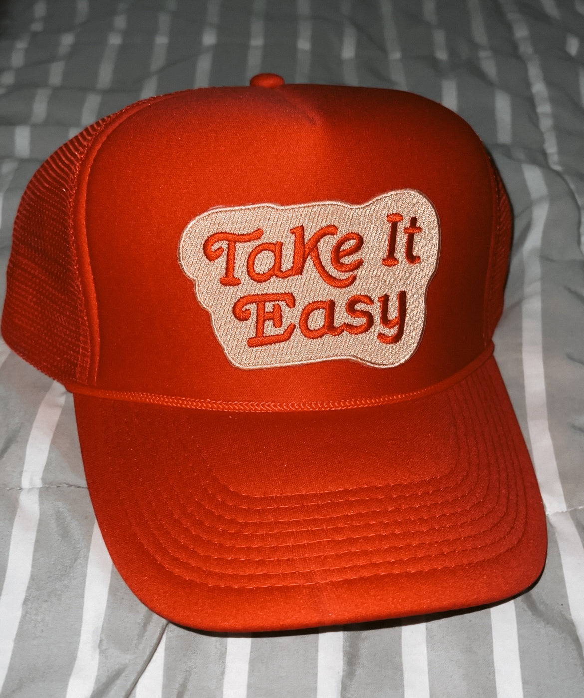 red hat with "Take it easy" red letter with khaki background patch 